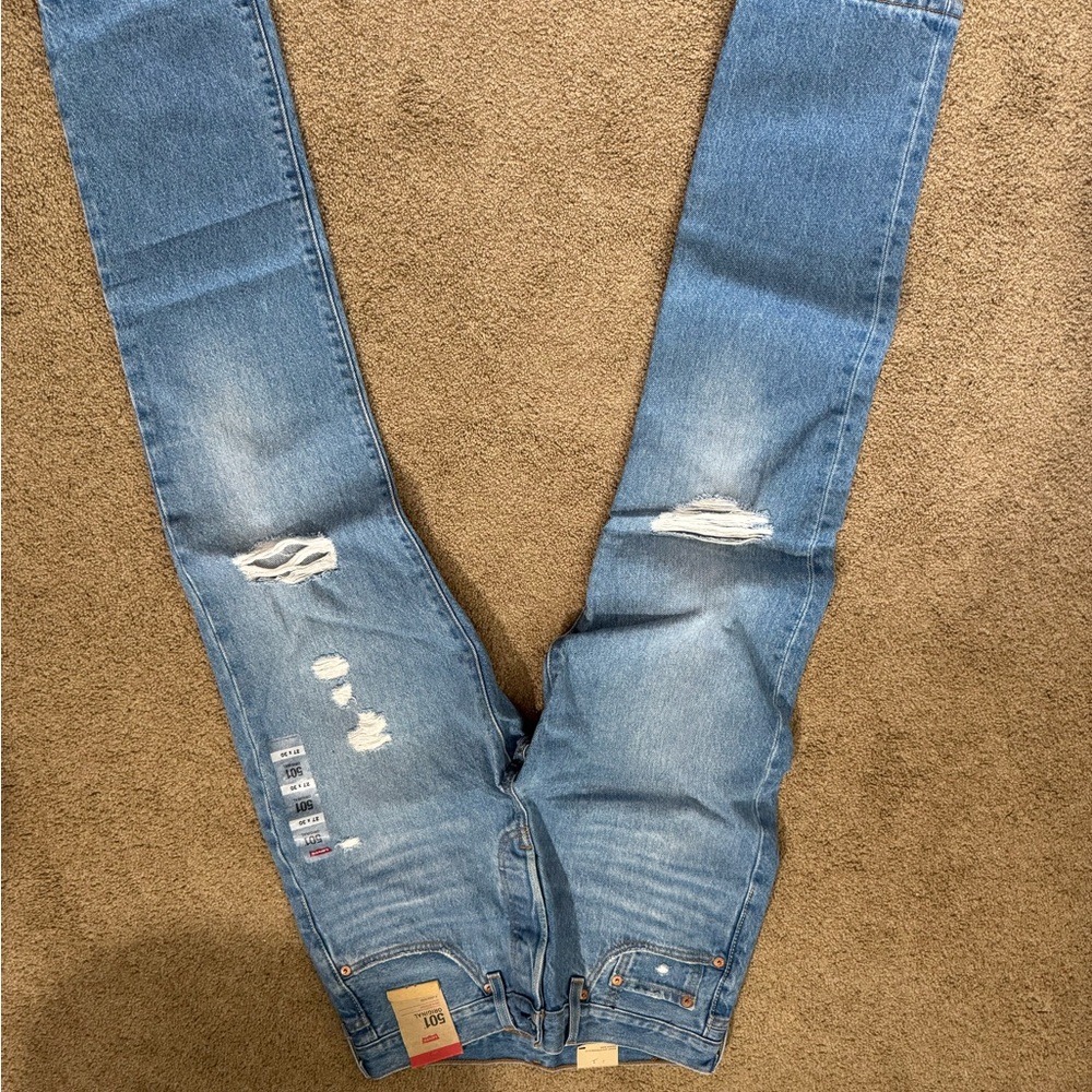 Levi's 501 Light Blue Ripped Jeans